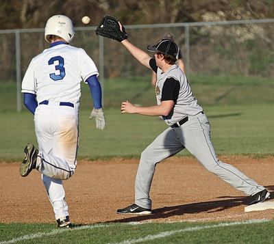 Image: First-baseman Bailey Walton makes the catch to beat the runner for an out.