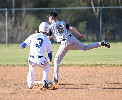 Image: Clayton Miller(6) leaps onto second-base in time to get the force out against Blooming Grove.