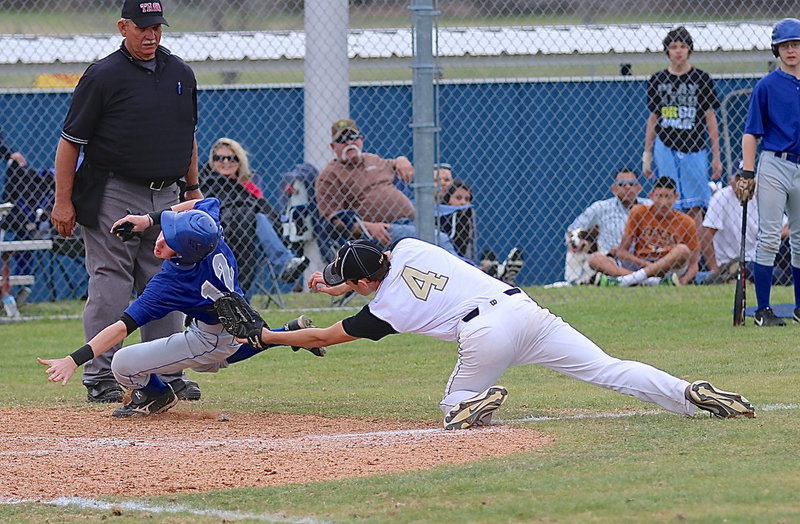 Image: Pitcher Ryan Connor(4) tags a Rice runner out before the Bulldog can reach home plate.