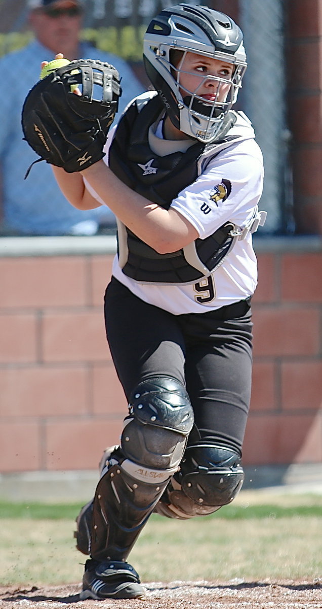 Image: Italy catcher Lillie Perry(9) rises to hold a Reicher runner on base.