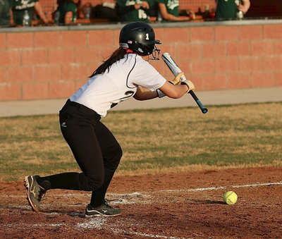 Image: Lady Gladiator Bailey Eubank(1) bunts one perfectly down the third-base line for a base hit.