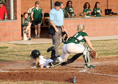 Image: Britney Chambers(4) slides head first across home plate for another Italy run against Lake Worth.
