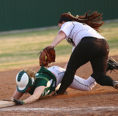 Image: Third-baseman Paige Westbrook(10) tags out a Lake Worth runner for Italy’s final out of the tournament.