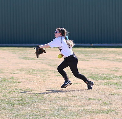 Image: Right fielder Tara Wallis(5) covers a grounder and then throws it to her cutoff. Textbook.