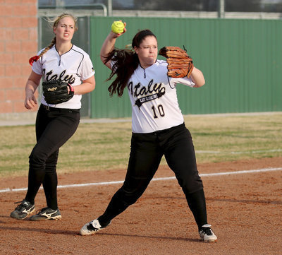 Image: With Madison Washington(2) backing up the play, Paige Westbrook(10) covers a bunt and then throws to first-base for the out.