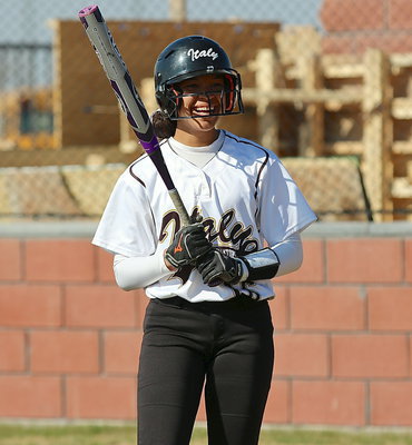 Image: April Lusk(6) is unable to contain her love for the game.