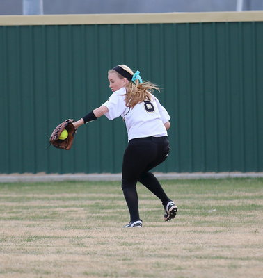Image: Hannah Washington(8) nabs a grounder hit into right field.
