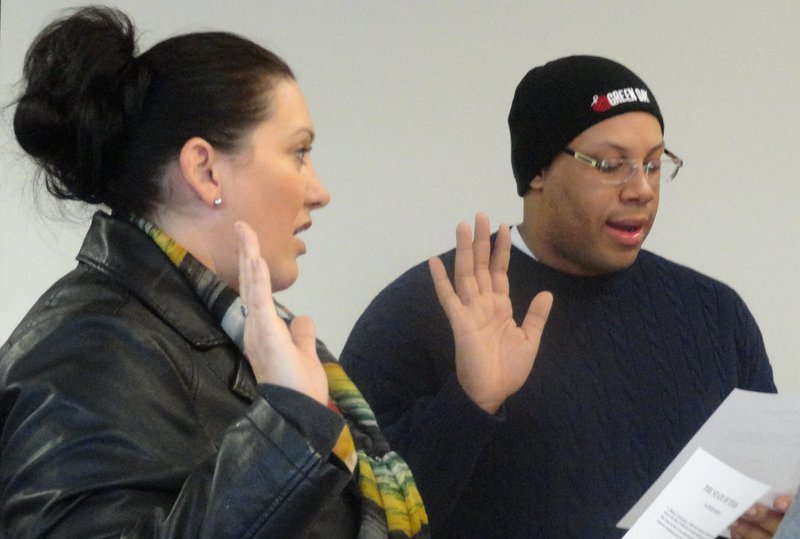 Image: Nancy Galloway Hinojosa and Christopher Baker take the Oath of Office to the Community Activities Committee.