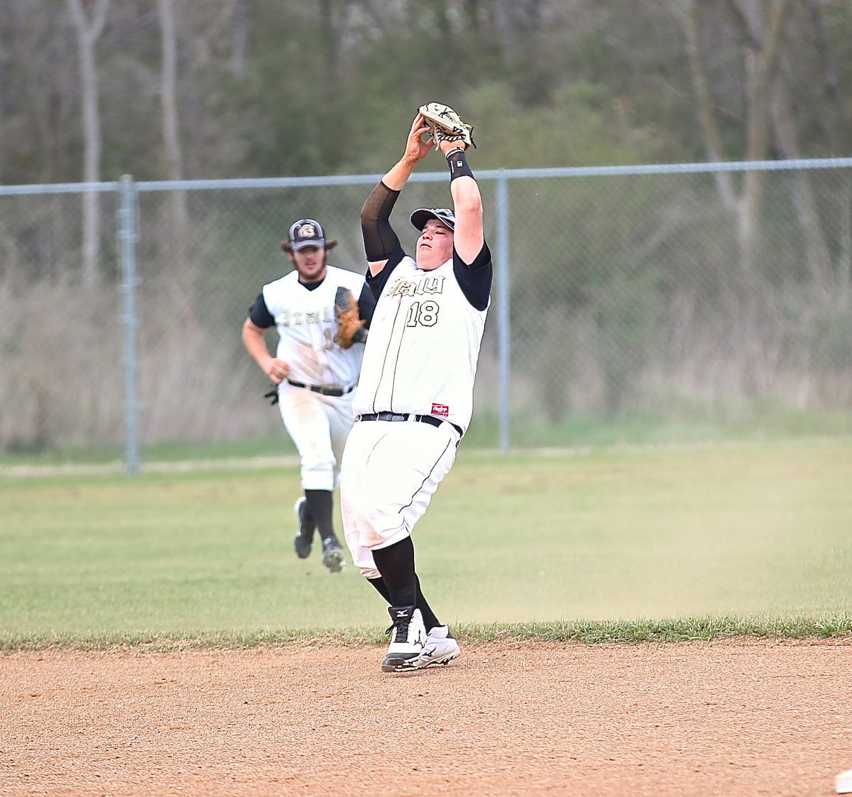 Image: John Byers(18) pulls in a pop-up at short.