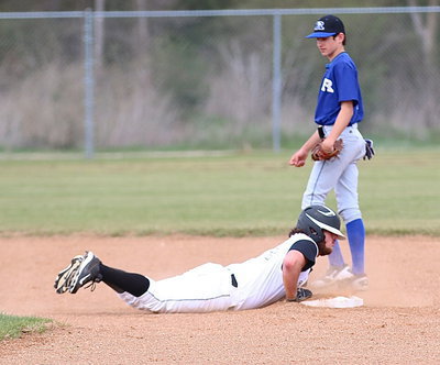 Image: Kyle Fortenberry(14) gets safely back to second-base.