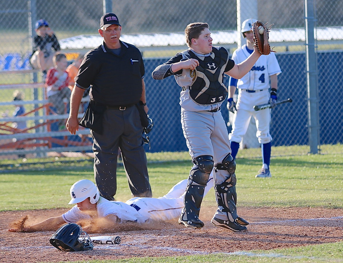 Image: Italy catcher John Escamilla makes the catch but the Lions get the run.