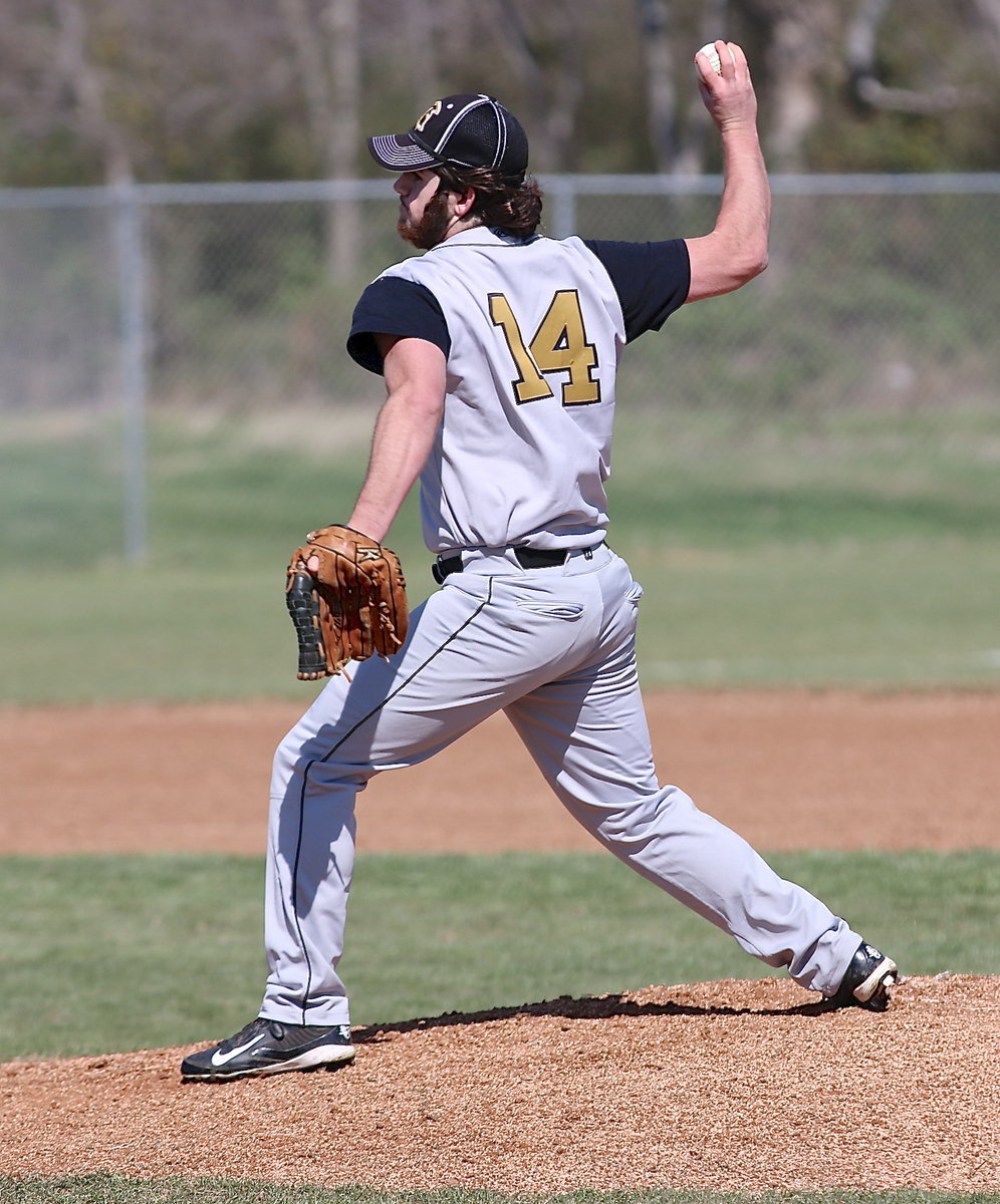 Image: Fear the beard! Kyle Fortenberry(14) does work on the mound for Italy.