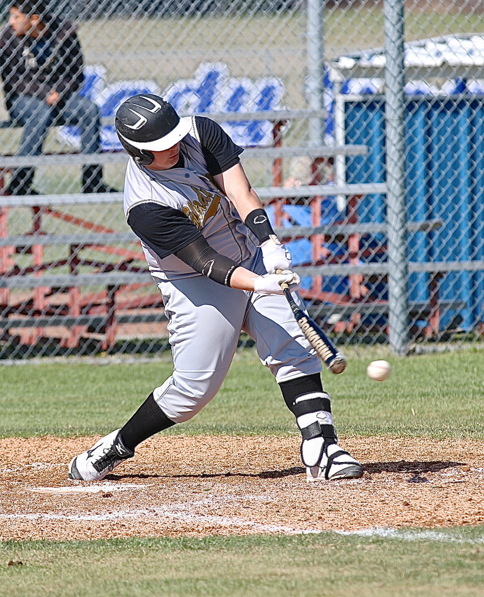 Image: John “Bat Bender” Byers(18) warps another bat.