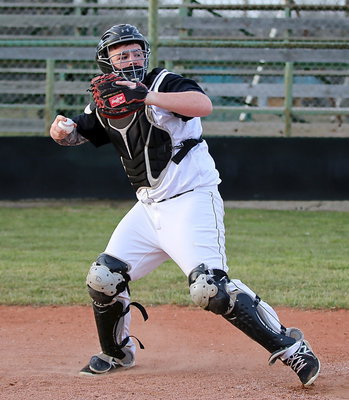 Image: Junior catcher Tyler Vencill throws down to second-base.