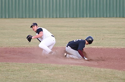 Image: Zain Byers(5) gets the force out at second-base against Faith Family.