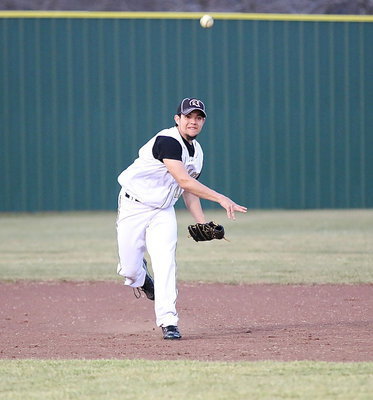 Image: Tyler Anderon(11) makes a throw from his shortstop position.
