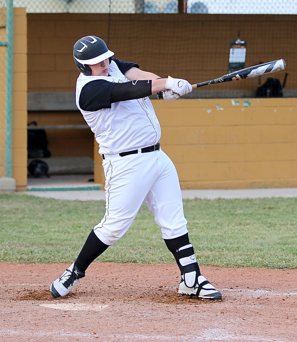 Image: John Byers(18) connects on a liner over the Faith Family infield.