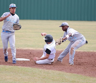 Image: Italy senior Tyler Anderson(11) avoids the tag while sliding onto second-base.