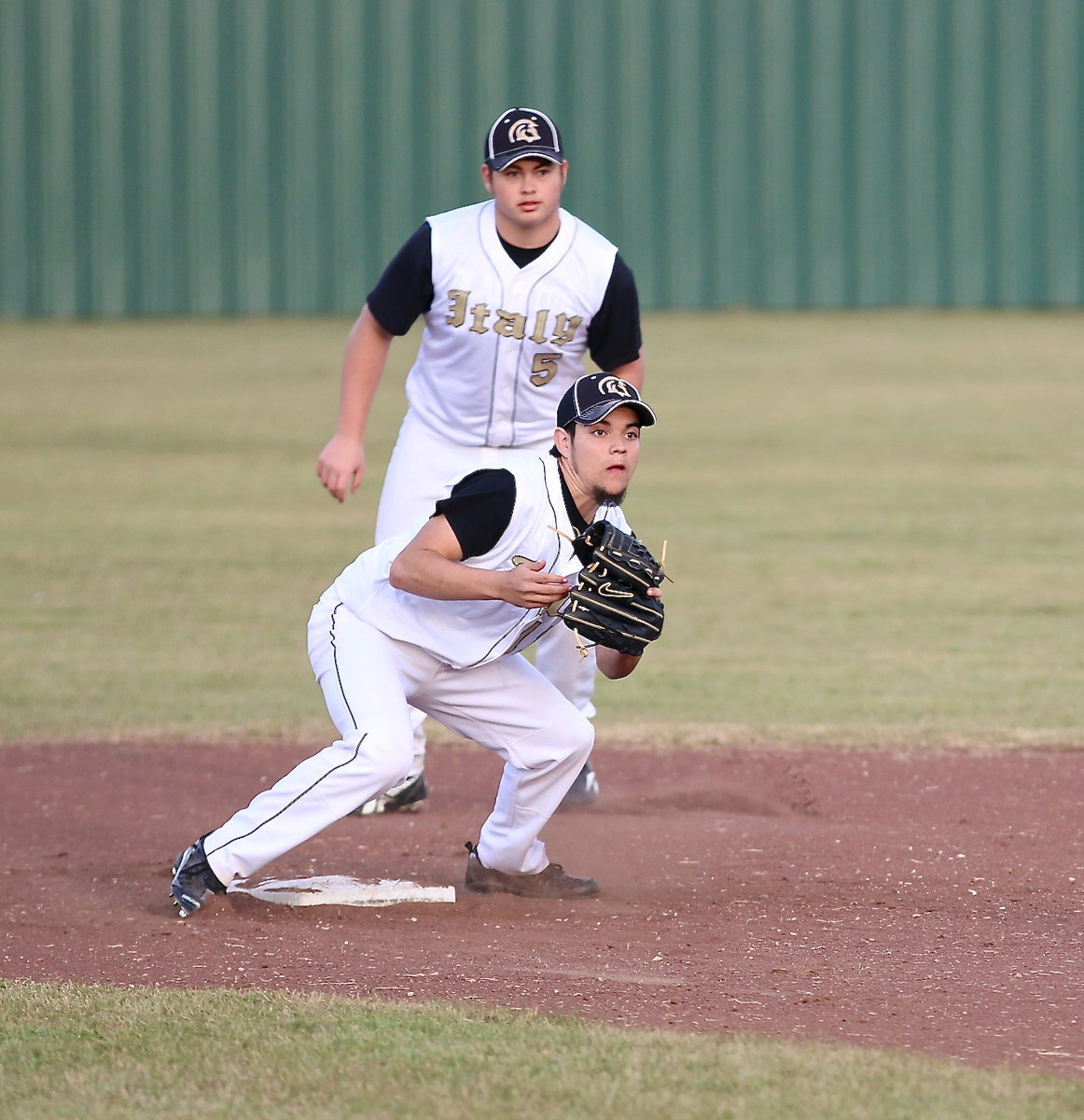 Image: Tyler Anderson(11) helps catch Roosevelt in a rundown with Zain Byers(5) backing up.