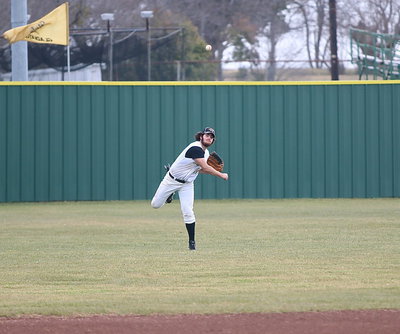 Image: Kyle Fortenberry(14) hurries a ball in from left field.