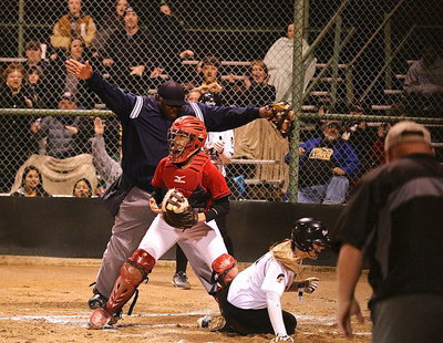 Image: Madison Washington(2) releases her excitement after being ruled safe by the home plate umpire.
