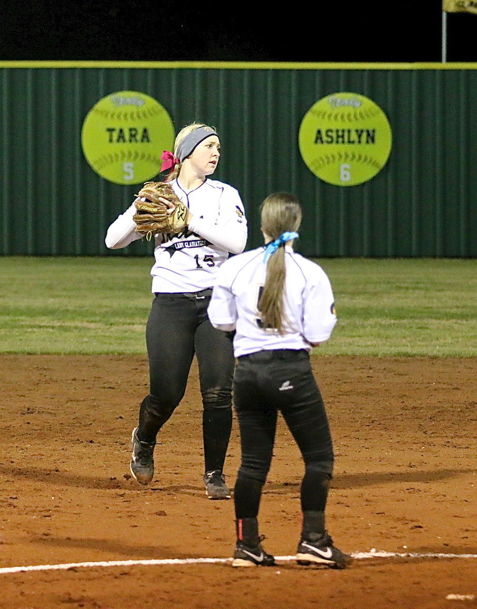 Image: Jaclynn Lewis(15) pulls in a fly ball at shortstop to give Italy a much needed out.