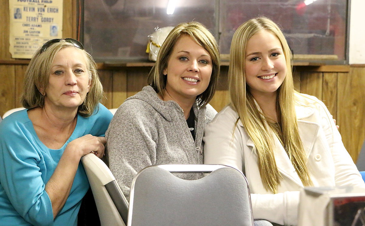 Image: Three generations: Betty Payne, Shelly Connor and Madison Washington, a band member, attend the dinner as one big family.