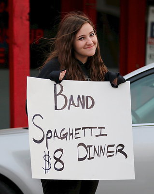 Image: Drum major Alexis Sampley drums up business outside the Uptown Cafe for the Italy Gladiator Regiment Band’s annual spaghetti dinner.