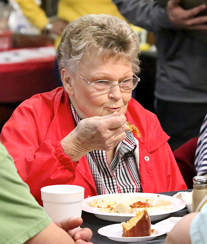 Image: Each year, Uptown Cafe owner Doris Mitchell allows the Italy High School Band to use her establishment for hosting their Spaghetti Dinner fundraiser. Of course, Doris doesn’t miss any of the action.