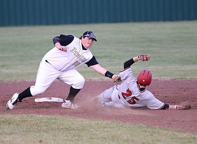 Image: Shortstop John Byers(18) tags out a Panther runner trying to steal.