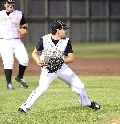 Image: Pitcher Tyler Anderson(11) covers a grounder and then looks to throw to second.