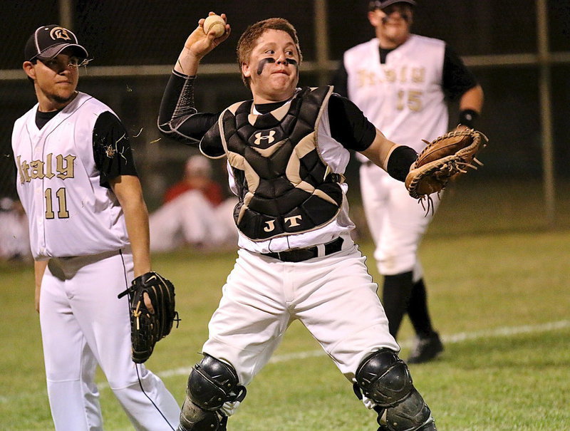 Image: Gladiator catcher John Escamilla covers a bunt and then lets the grass fly as he throws to first-base.