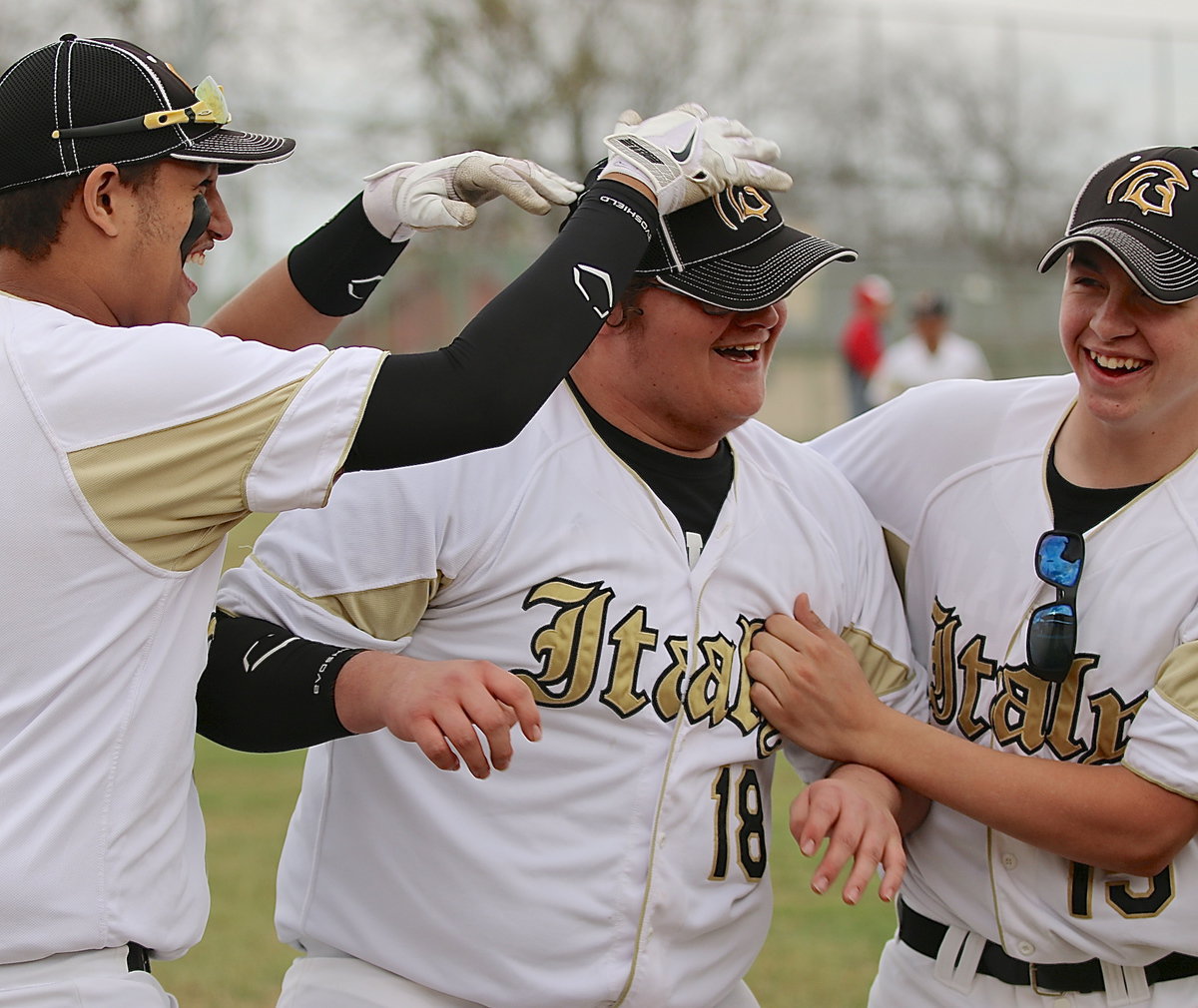 Image: Tristen Cotten and Austin Crawford congratulate teammate Colin Newman(18) after Newman recorded his first career strikeout. Maypearl’s JV won the war but Italy’s boys won a few battles along the way.