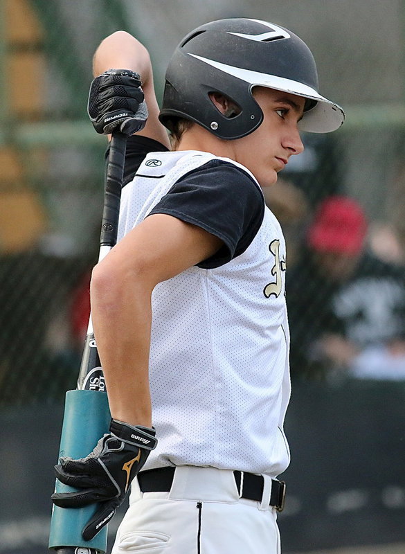 Image: Levi McBride(1) stretches out before stepping into the batter’s box against Maypearl.