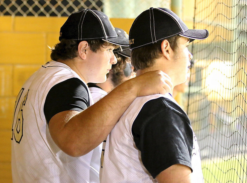 Image: Senior buds Kevin Roldan(16) and Zain Byers(5) keep their teammates fired-up.