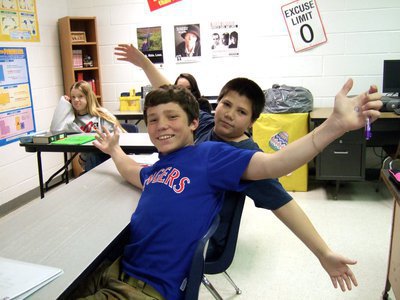 Image: These two boys are proud of their accomplishments.