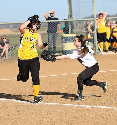 Image: Tara Wallis(5) scoops up a grounder and then tags an Itasca runner out down the first-base line.