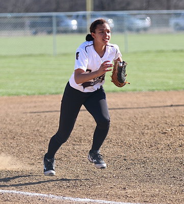 Image: Freshman third-baseman April Lusk(18) charges a bunt for the Lady Gladiators.