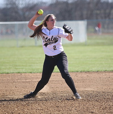 Image: Lady Gladiator Madison Washington(2) fields a grounder at shortstop and then throws to first-base.