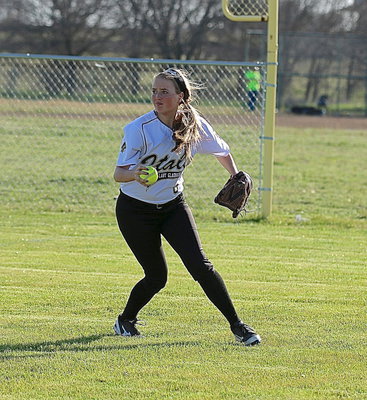 Image: Right fielder Hannah Washington(8) tracks down a grounder for the Lady Gladiators.