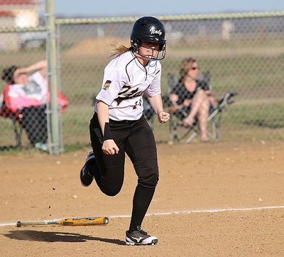 Image: Lady Gladiator junior Kelsey Nelson(14) gets on base with two run single.