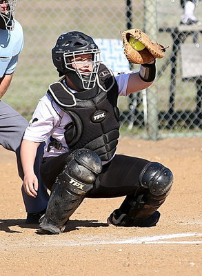 Image: Paige Westbrook(10) eyes the pitch into her catcher’s mitt.