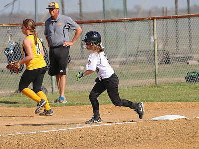 Image: Tara Wallis(5) thinks about running home after an overthrow.