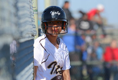 Image: Waiting for her turn at bat is April Lusk(18).