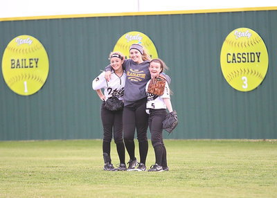 Image: Lady Gladiator outfielders Britney Chambers(4), Kelsey Nelson(14) and Tara Wallis(5) are ready to defend their home field.