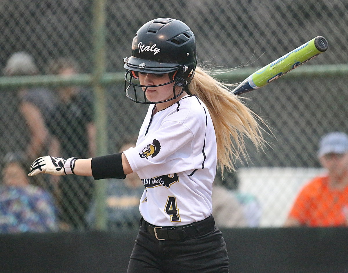 Image: Britney Chambers(4) takes a practice swing before stepping into the batter’s box.