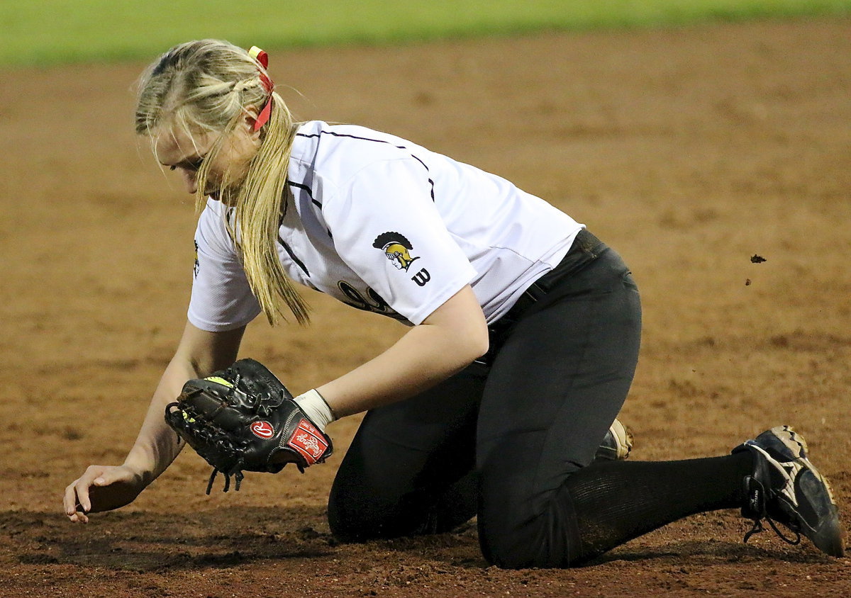 Image: Madison Washington(2) makes a spectacular tumbling catch on a line drive hit to short.