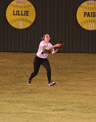 Image: Kelsey Nelson(14) tracks down a fly ball hit to centerfield for an out.