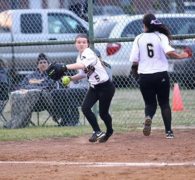 Image: Right fielder Tara Wallis(5) backs up an overthrow at first-base. Love those hustle plays.