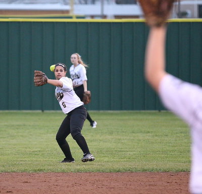 Image: Center fielder Kelsey Nelson(14) relays the ball into second-baseman Ashlyn Jacinto(6) who then throws it to the pitcher’s mound.